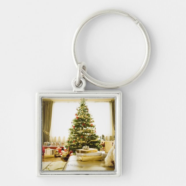 dog posing in front of Christmas tree Keychain (Front)