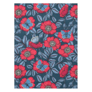 Dog rose and butterflies in blue and red tablecloth