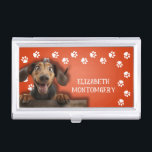Dog Walker Paw Prints Business Card Case<br><div class="desc">This business card holder,  personalized with your name,  features a cute Dachshund on bright orange with a white paw print border. Fun as a gift or a great way to carry your own business cards.</div>
