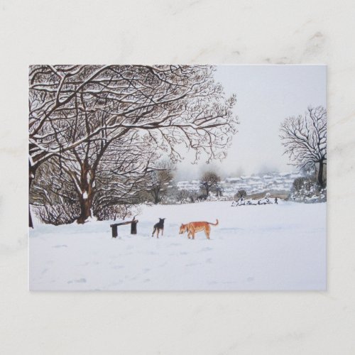 dogs playing in snowy landscape at christmas postcard