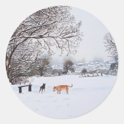dogs playing in snowy landscape scenic christmas classic round sticker