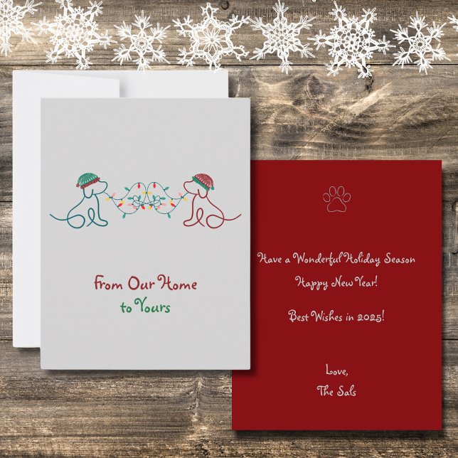 Dogs Playing with Christmas Lights Party Note Card (From Our Home to Yours. Featuring 2 cute dogs with winter hats and Christmas lights. Very Festive!)