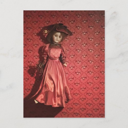 doll on a wall postcard
