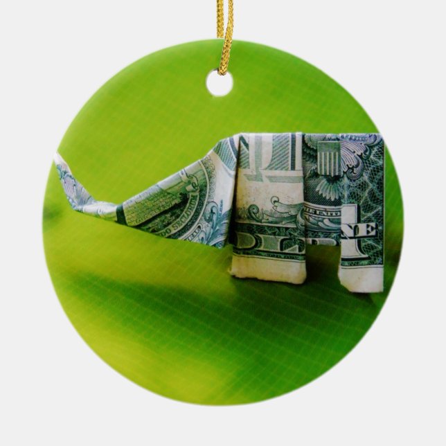 Dollar bill origami Elephant on Green background Ceramic Ornament (Front)