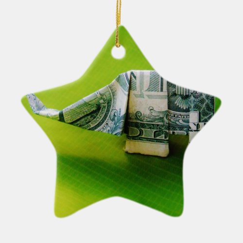 Dollar bill origami Elephant on Green background Ceramic Ornament