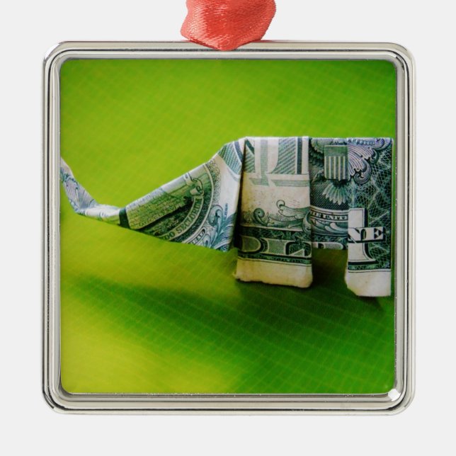 Dollar bill origami Elephant on Green background Metal Ornament (Front)