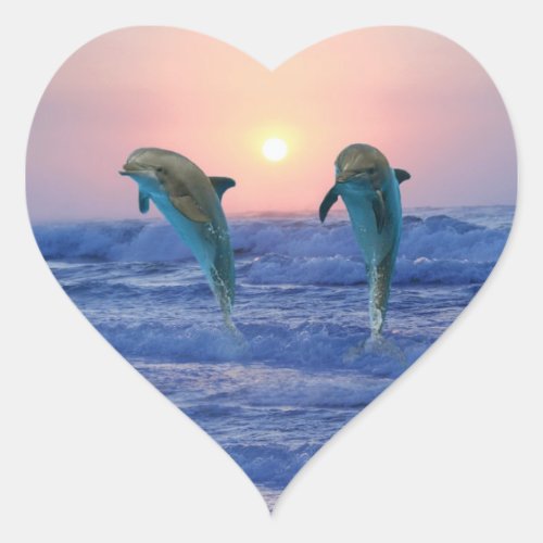 Dolphins at sunrise heart sticker