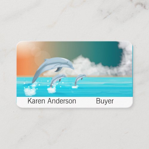 dolphins breaching in the ocean      business card