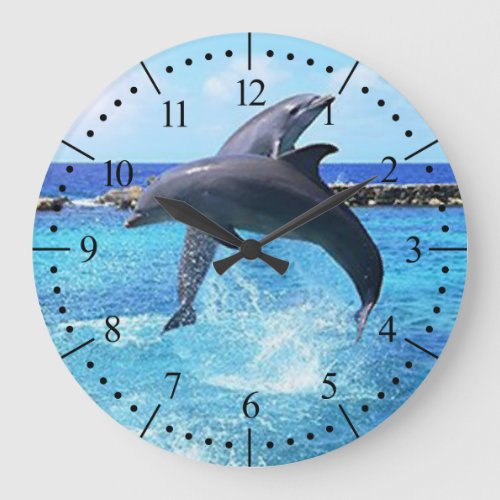Dolphins in beautiful blue ocean large clock