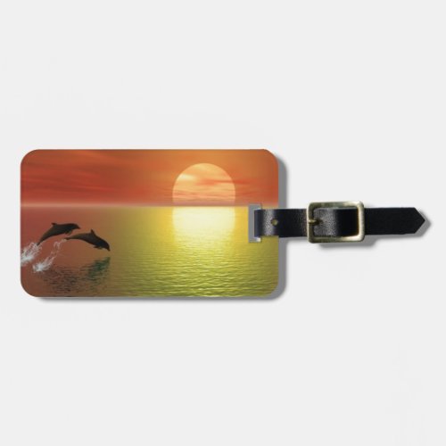dolphins jumping ocean sunset luggage tag