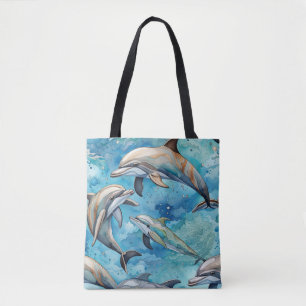 Dolphins swimming in the sea tote bag