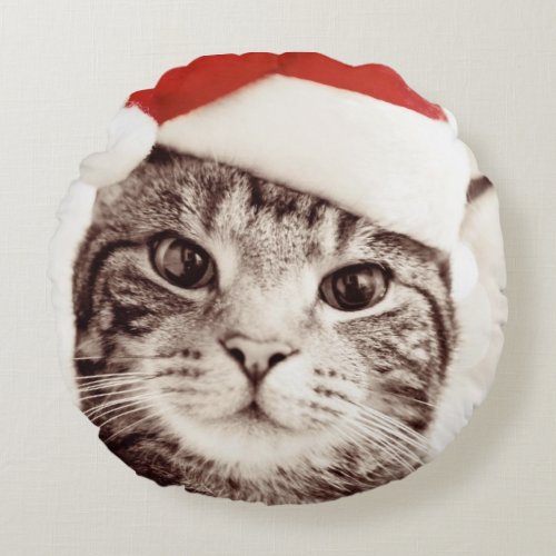 Domestic tabby cat wearing red Christmas hat Round Pillow
