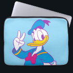 Donald Duck Peace Sign Laptop Sleeve<br><div class="desc">Brighten up your wardrobe with this electric and cheerful Donald Duck illustration! Featuring a classic full-body pose with a friendly peace sign, this design gets a stylish update with a vibrant, non-traditional color palette. The combination of bright cyan, magenta, and sunny yellow gives this artwork a fresh, "neon-pop" aesthetic that...</div>