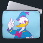 Donald Duck Peace Sign Laptop Sleeve<br><div class="desc">Brighten up your wardrobe with this electric and cheerful Donald Duck illustration! Featuring a classic full-body pose with a friendly peace sign, this design gets a stylish update with a vibrant, non-traditional color palette. The combination of bright cyan, magenta, and sunny yellow gives this artwork a fresh, "neon-pop" aesthetic that...</div>