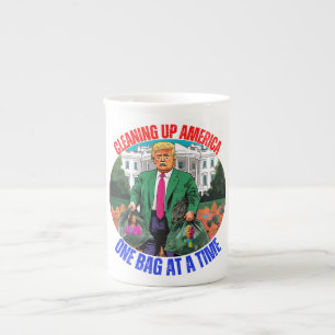 DONALD TRUMP-CLEANING UP AMERICA ONE BAG AT A TIME BONE CHINA MUG