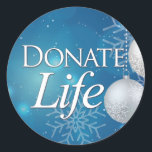 Donate Life with Ornaments & Snowflakes Classic Round Sticker<br><div class="desc">This wintry Donate Life sticker will add an extra sparkle to your holiday packages, tissue paper or Christmas envelopes. It's also a great way to promote donor awareness during the holiest time of year. It's the season of giving... give the Gift of Life. Donate Life. Transplant Recipients, Donor Families and...</div>
