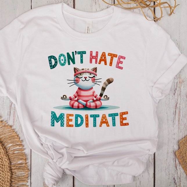 "Don't Hate Meditate" Funny Cat Lovers Tri-Blend Shirt ("Don't Hate Meditate" Funny Cat Lovers Tri-Blend Shirt on a desk with boho decoration)