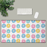Donut  desk mat<br><div class="desc">This fun desk mat is decorated with a donut pattern of pink,  blue,  turquoise,  and yellow donuts on a colorful sprinkle background. Perfect for your favorite donut lover!
Original Watercolor Donuts © Michele Davies.</div>