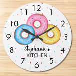 Donut Kitchen Personalized Large Clock<br><div class="desc">This fun clock is decorated with three donuts in blue, pink and yellow on a sprinkle background. Easily customizable with your name. Use the Customize Further option to change the text size, style or color if you wish. Because we create our own artwork you won't find this exact image from...</div>