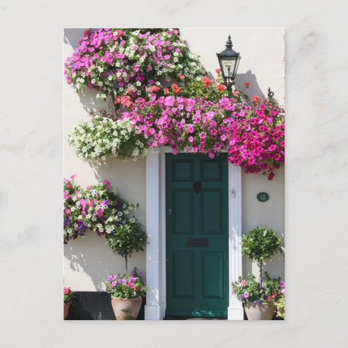 Doorway surrounded by flowers postcard