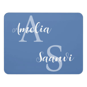 Dorm room door sign with two names in blue