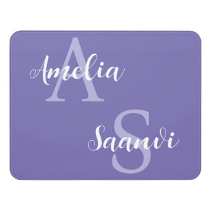 Dorm room door sign with two names in purple
