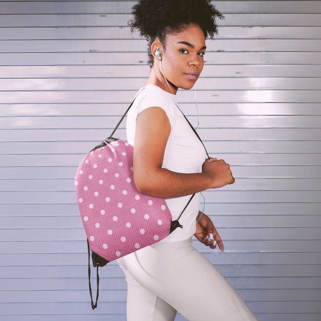 Dotty Delight Pink Drawstring Bag (A fitness woman is carrying a Dotty Delight pink drawstring bag. 
)