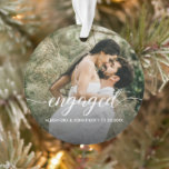 Double sided Engaged couple Photo Custom  Ornament<br><div class="desc">Celebrate the start of forever with our Personalized Engaged Photo Ornament, a beautiful keepsake to mark one of life’s happiest moments. This elegant round ornament showcases your favorite engagement photo with the word “engaged” in graceful white script, along with your names and engagement date. It’s the perfect way to remember...</div>