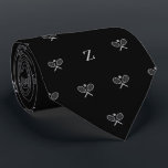 Double Tennis Rackets Ball Monogram Initial Black Neck Tie<br><div class="desc">Serve up a stylish ace with our Double Tennis Rackets and Ball Skinny Tie – the perfect accessory for the tennis aficionado in your life. This tie isn't just a fashion statement; it's a visual celebration of the love for this dynamic sport, making it an ideal gift for tennis fans,...</div>