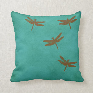 Dragonflies and teal colored pillow