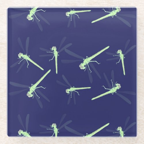 Dragonflies on blue glass coaster