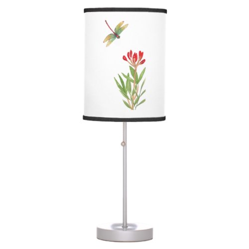 dragonfly flying over a plant table lamp