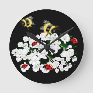 Dramatic Bees ladybugs and white flowers on black Round Clock