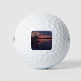 Dramatic sunset over Thousand Island river Golf Balls