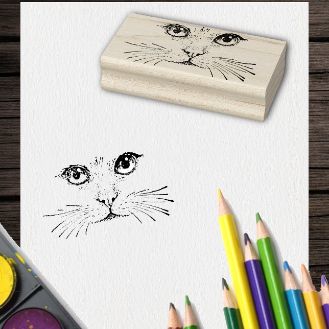 Drawing of Cat Face with Eyes Nose Long Whiskers Rubber Stamp (Black drawing of cat face with eyes and long whiskers on craft rubber stamp.)