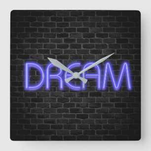DREAM text in neon lights on brick Square Wall Clo Square Wall Clock
