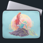 Dreamy Ariel on the Rocks Laptop Sleeve<br><div class="desc">Let your imagination swim free with this stunning illustration of Ariel, the curious mermaid princess, basking in the glow of a dreamy pastel sunset! Perched on her favorite rock with her iconic flowing red hair and shimmering tail, Ariel captures the magic of undersea wonder and the thrill of dreaming big....</div>