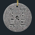 Dreidel Instructions Happy Hanukkah Silver Glitter Ceramic Ornament<br><div class="desc">Decorative and convenient way to keep instructions for playing the Jewish children's game of dreidel at hand... your kids can take a look when they need a reminder of how to play and what the Hebrew letters are called. Great Hanukkah gift! BE SURE TO CHANGE THE MESSAGE ON BACK OF...</div>