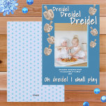 Dreidel Rustic Oak Blue Photo Celebrate Hanukkah Holiday Card<br><div class="desc">Custom photo Hanukkah cards are a lovely way to connect with friends and family during the Festival of Lights. This cute design features your photo with a drop shadow of sky blue on a background of rich medium dark blue. Seven little images of oak wood texture dreidels twirl around the...</div>