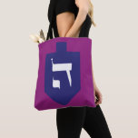 Dreidel w. Hebrew Letters Hey Shin Hanukkah Tote Bag<br><div class="desc">Indigo-blue dreidel on vibrant dark magenta background with the Hebrew letter shin on one side and hey on the other for the celebrations of the Jewish holiday of Hanukkah. Traditionally, during the holiday of Chanukah, children (and often adults) play a safe-hazard game with a dreidel (or sevivon in modern Hebrew)....</div>