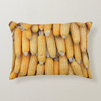 Dried corn that was stacked . accent pillow