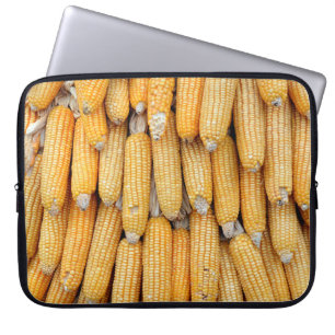 Dried corn that was stacked . laptop sleeve