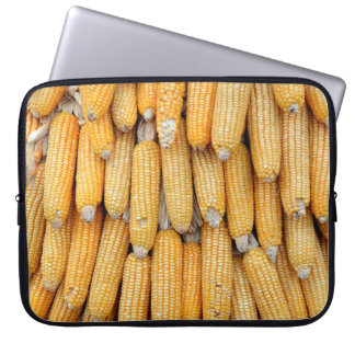 Dried corn that was stacked . laptop sleeve