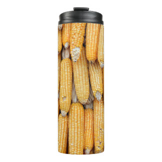 Dried corn that was stacked . thermal tumbler