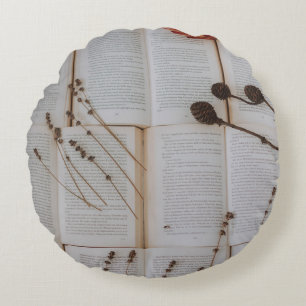 Dried flowers on books round pillow