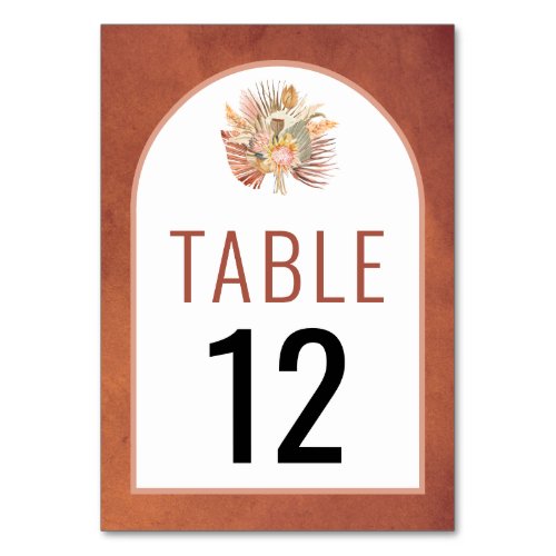 Dried palms and pampas grass terracotta wedding table number