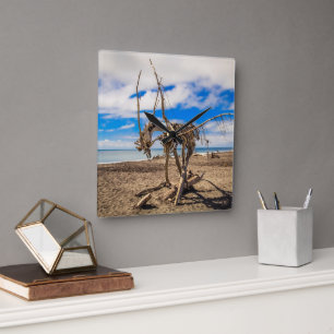 Driftwood artwork on Hokitika Beach, New Zealand Square Wall Clock