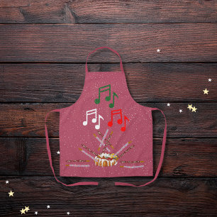 Drum cake, cookie batons, and musical notes pink apron