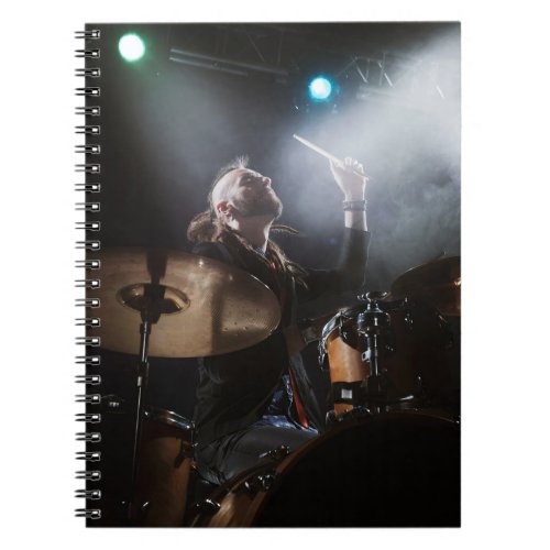 Drummer silhouette dark stage setting notebook