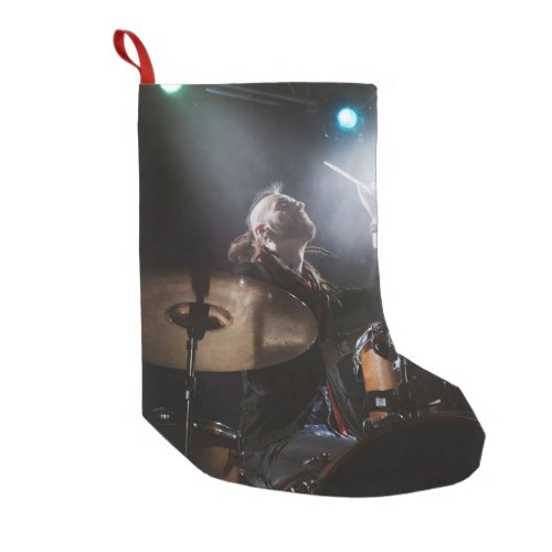 Drummer silhouette dark stage setting small christmas stocking